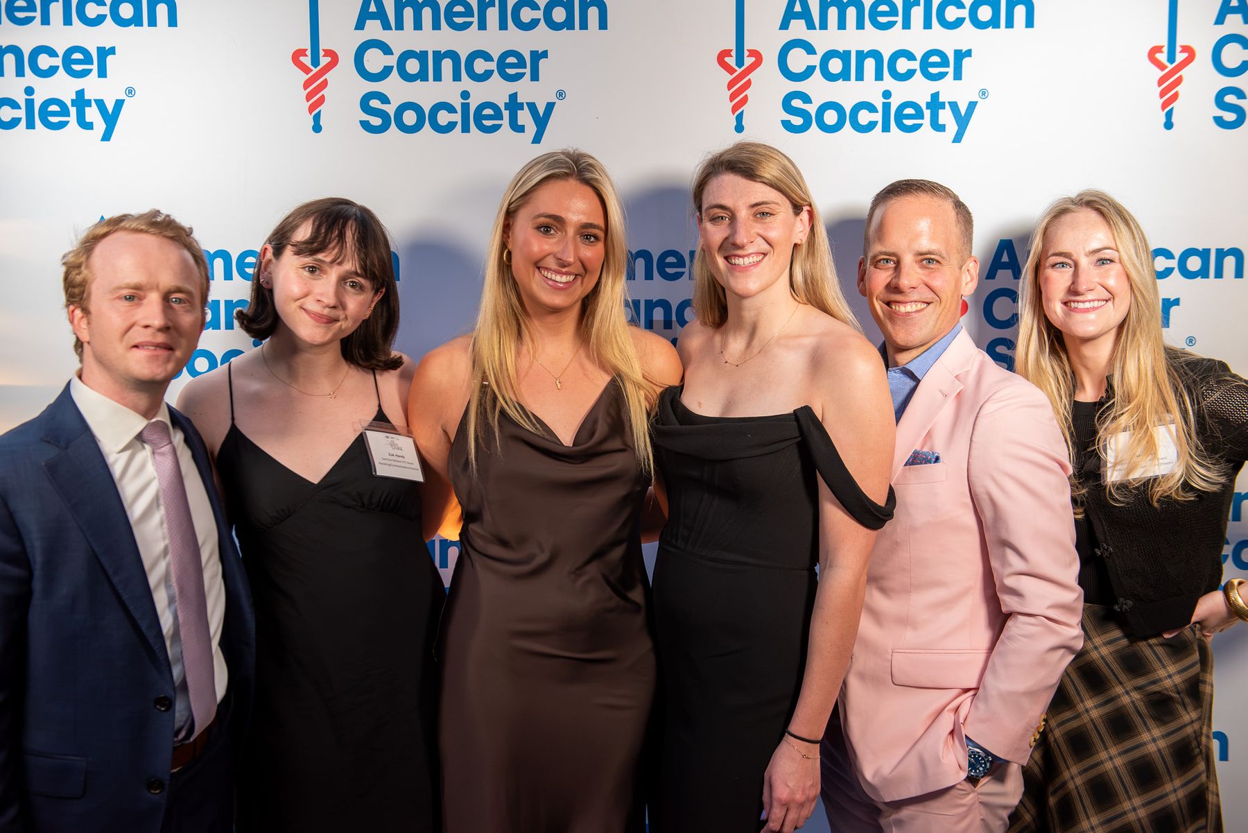 Guests posing together at a charity gala
