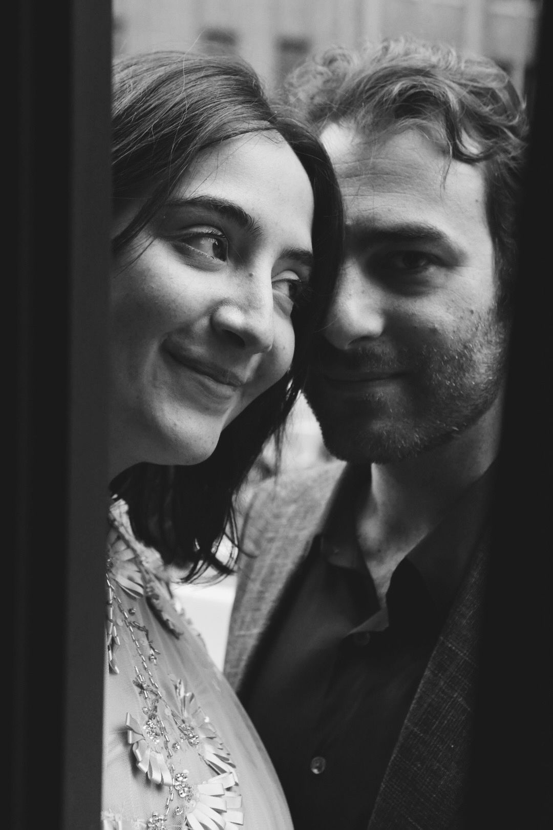 A couple cheek to cheek, in black and white